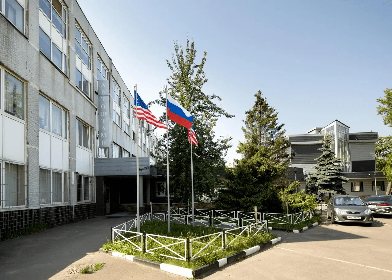 TBN facility entrance with flags