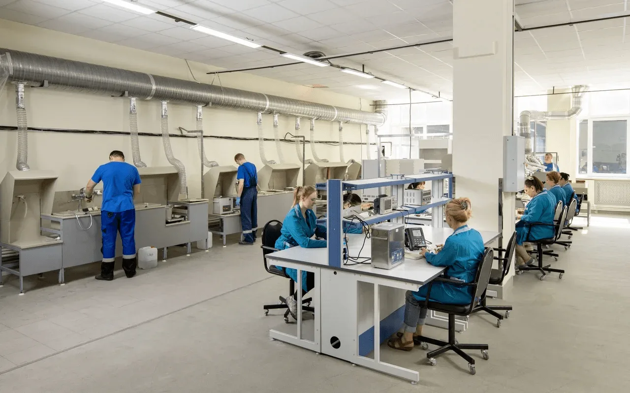 Production facility with workers assembling modules